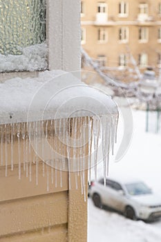 Icicles on the facade of a close-up