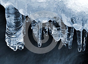 Icicles on a frozen creek