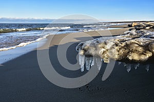 Icicles and frozen rocks on the Baltic Sea. Beautiful winter landscape