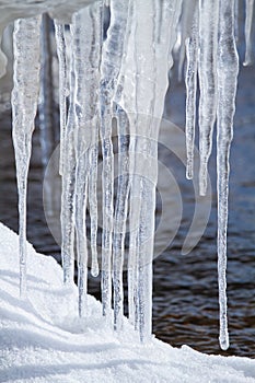 Icicles hang on the river bank