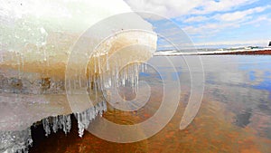 Icicles on the melting snow on Lake Superior in the Spring