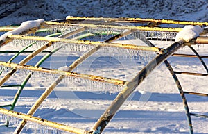 Icicles on playground equipment after an ice storm.