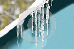 Icicles from the roof, frozen water hanging from the roof