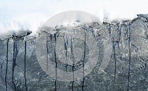 Icicles and snowy rocks