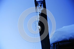 Icicles sparkling white melting ice hanging down concept for warming. copy space.