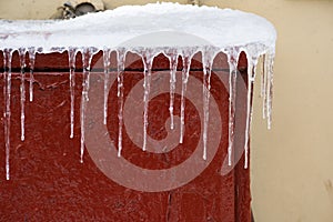 Icicles on the street electrical panel