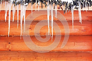 Icicles on a wooden background