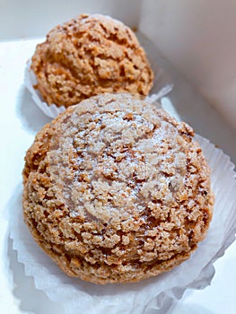 Icing sugar on Two Cookie cream Puffs craquelin looks yummy photo