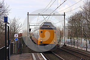 ICM koploper intercity along platform of train station Nieuwerkerk aan den IJssel