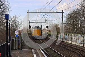 ICM koploper intercity along platform of train station Nieuwerkerk aan den IJssel