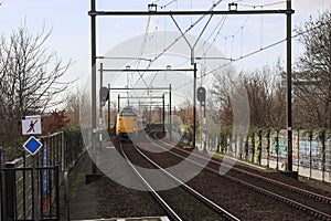 ICM koploper intercity along platform of train station Nieuwerkerk aan den IJssel