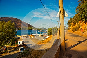 ICMELER, TURKEY: Landscape with a view of the coast and ships in Icmeler on a sunny summer day, near Marmaris in Turkey.