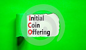 ICO initial coin offering symbol. Concept words ICO initial coin offering on beautiful white paper. Beautiful green paper photo