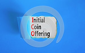 ICO initial coin offering symbol. Concept words ICO initial coin offering on beautiful white paper. Beautiful blue paper photo