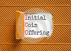 ICO initial coin offering symbol. Concept words ICO initial coin offering on beautiful white paper. Beautiful brown paper