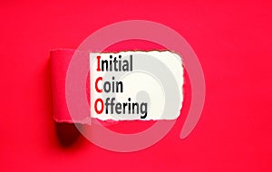 ICO initial coin offering symbol. Concept words ICO initial coin offering on beautiful white paper. Beautiful red paper background