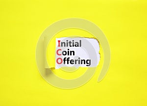 ICO initial coin offering symbol. Concept words ICO initial coin offering on beautiful white paper. Beautiful yellow paper photo