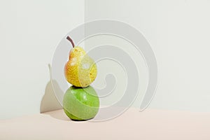 Icometric view of pears and apples in sunlight. Modern composition