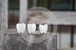 Icon of decayed tooth and healthy tooth