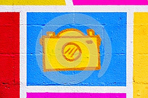 Icon of a photographic camera painted on a wall