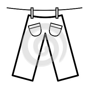 Icon with trousers dries on clothespins.