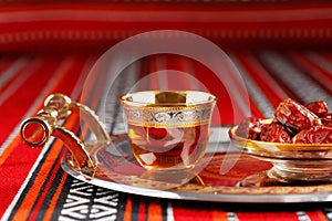 Iconic Abrian fabric tea and dates symbolise Arabian hospitality