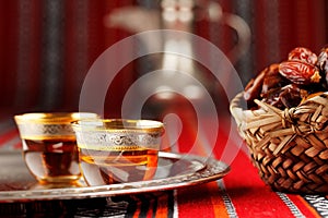 Iconic Abrian fabric tea and dates symbolise Arabian hospitality photo