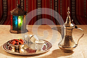 Iconic Abrian fabric tea and dates symbolise Arabian hospitality photo