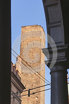 Medieval Asinelli Tower framed by an archway in Bologna photo