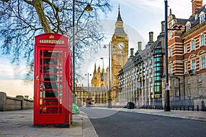The iconic British old red telephone box with Big Ben, London photo