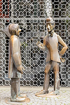 Bronze Statues of Tunnes and Schal in Cologne, Germany, Captured in Daylight