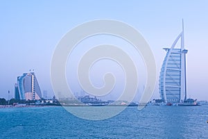 Iconic Burj Al Arab Hotel and the adjacent Jumeirah Colony. Evening scene