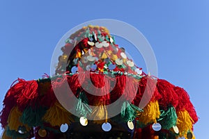 Iconic, colorful hat of a traditional water seller in Marrakech, Morocco