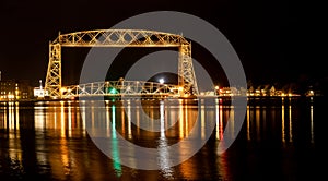 The iconic Duluth Minnesota Aerial Lift Bridge with reflections on calm harbor waters