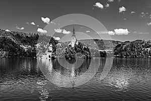 Iconic landscape of Lake Bled and the church island in the middle of the lake with water reflections in Bled, Slovenia