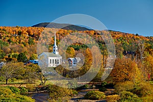 Iconic New England church in Stowe town at autumn