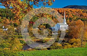 Iconic New England church in Stowe town at autumn