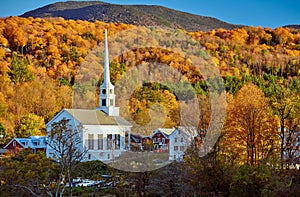 Iconic New England church in Stowe town at autumn