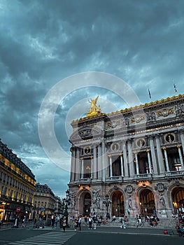 Iconic Palais Garnier opera house in Paris, France, on a cloudy and stormy day