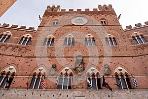 The iconic Palazzo Pubblico at the Piazza del Campo in downtown Siena