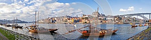 The iconic Rabelo Boats, the traditional Port Wine transports, with the Ribeira District and the Dom Luis I Bridge