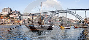 The iconic Rabelo Boats, the traditional Port Wine transports, with the Ribeira District and the Dom Luis I Bridge