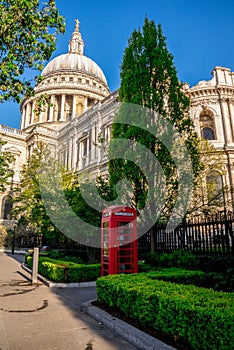 Iconic Red Telephone Booth in St Paul`s Cathedral churchyard in central London