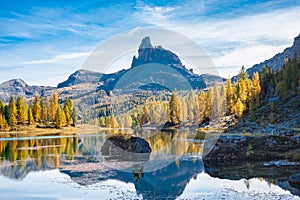 Iconic rock near an alpine lake in autumn