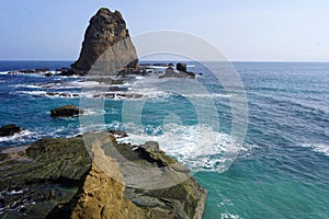 Iconic rock at the papuma beach Jember, Indonesia photo