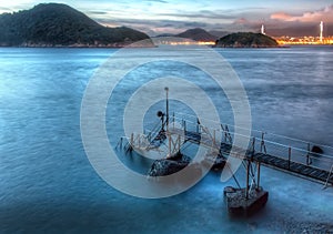 Iconic Sai Wan Swimming Pier and Shed at Dusk with Night Skyline in Kennedy Town, Hong Kong