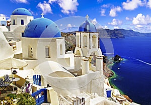 Iconic Santorini - most beautiful island in Europe. view with traditional churches in Oia village. Greece