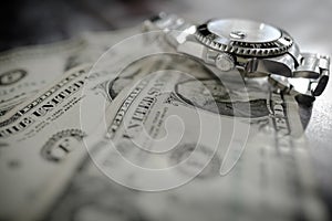 Iconic, swiss manufactured men`s automatic diving watch seen on used dollar bills.