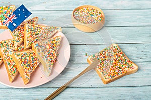 Iconic traditional Australian party food, Fairy Bread, on a red, white and blue background