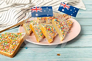 Iconic traditional Australian party food, Fairy Bread, on a red, white and blue background